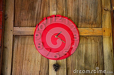 Interior decorate with red clock on wooden wall Stock Photo