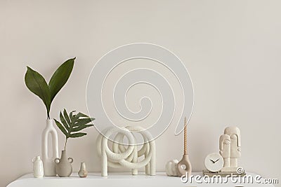 Interior design of aesthetic and elegant room with white commode, plants, book, decoration, vase with leaf and personal Stock Photo