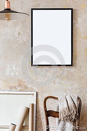 Interior design of living room with black poster mock up frame, chair and elegant personal accessoreis. Grunge wabi sabi wall. Stock Photo