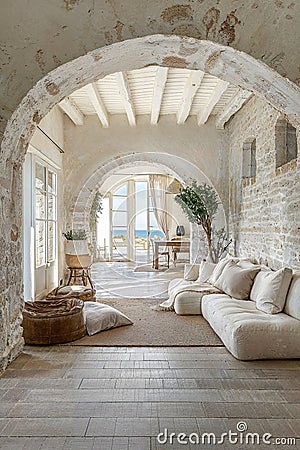 interior design photo of an architectural of a well maintained and luminous Tuscan house in white stone texture and with luxury Stock Photo