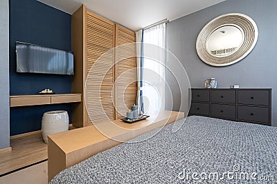 Interior design of villa, house, home, condo and apartment feature bedroom, king size bed, and grey wall Stock Photo