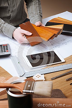 Interior designer choosing a baseboard Stock Photo