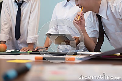 interior designer working with graphic tablet at workplace. artist discussing design and idea at office. business people Stock Photo