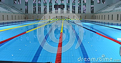 Interior details of lanes and seating in Olympic sized swimming pool Stock Photo