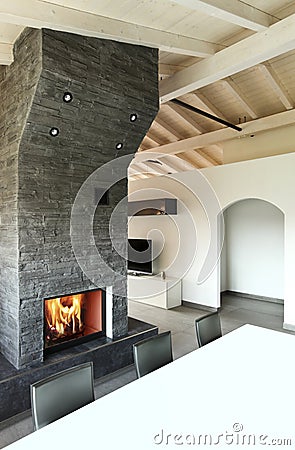 Interior, dining table and fireplace Stock Photo