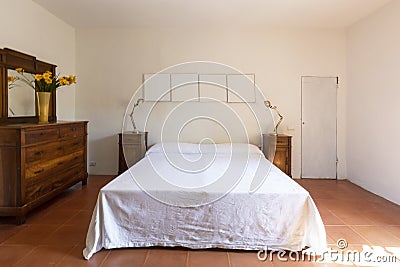 Interior of a double bedroom in a rustic and country style. We are in Italy Stock Photo