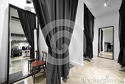 Interior of dressing room at cloth store Stock Photo