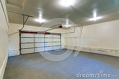 Interior of an empty clean garage with closed door Stock Photo