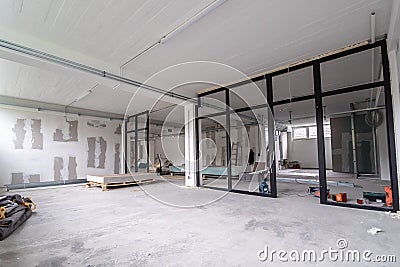 Interior empty office light room in a new building renovation or under construction. Glass doors and Windows Stock Photo