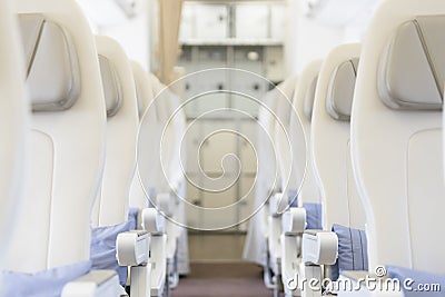 Interior of empty ready to fly airliner cabin with rows of seats Stock Photo