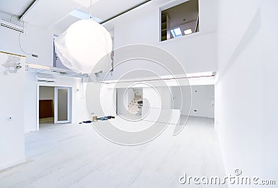 Interior of empty stylish modern open space two level apartment Stock Photo