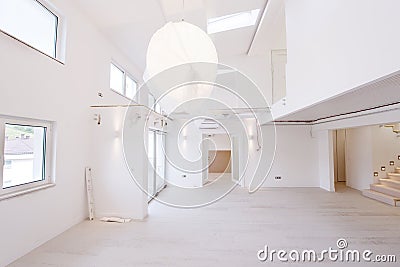 Interior of empty stylish modern open space two level apartment Stock Photo