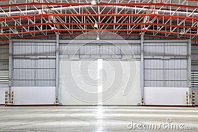 Interior of factory with shutter door Stock Photo