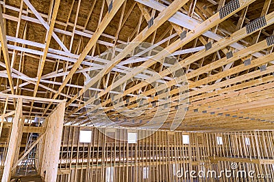Interior framing of a new house under construction with roof trusses built frame Stock Photo