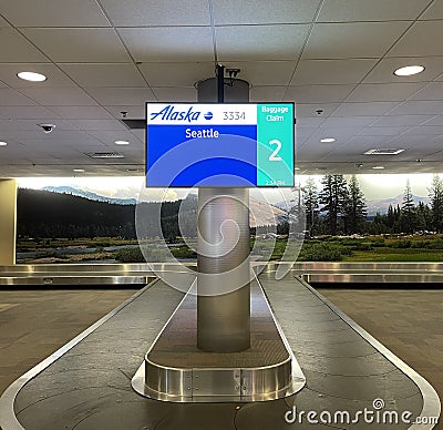 Interior of the Fresno airport baggage claim area in the US Editorial Stock Photo