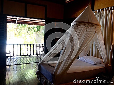 Interior furnishings bedroom bed private balcony beachfront chalet Stock Photo