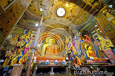 Interior of Gangaramaya Temple with iconic large seated Buddha image in `earth touching` pose, Colombo, Sri Lanka Editorial Stock Photo