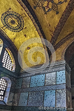 The interior of Hagia Sophia, sheathed with polychrome marbles, green and white with purple porphyry, and gold mosaics Editorial Stock Photo