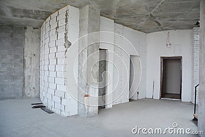 Interior hall room under construction, metal door lintels. Wall without plasterwork and ready to remodel Stock Photo