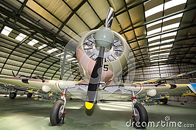 Interior of an hangar with some rare vintage interceptor airplanes Editorial Stock Photo