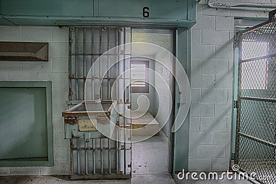 Empty high risk solitary confinement cell in abandoned prison Stock Photo