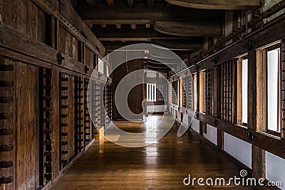 Interior of the Himeji Castle with the weapon racks on the wall in Hyogo, Japan Stock Photo