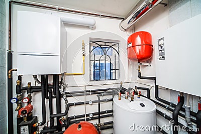 Interior household boiler with gas and electric boilers Stock Photo