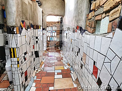 An interior of the Hundertwasser public toilet in the small ruratown of Kawakawa in New Zealand I Editorial Stock Photo