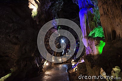 Interior inside cavern of Wat Tham Nam or Water Cave Temple for thai people visit respect praying blessing ancient buddha and Stock Photo