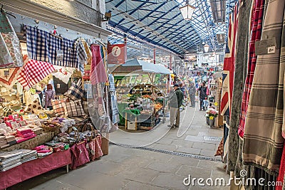 Interior inside of market hall showing a variety of stalls vendors and customers browsing Editorial Stock Photo