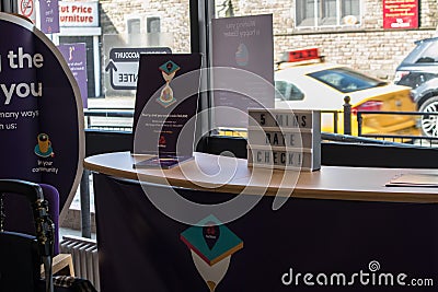 Interior inside of Natwest Bank high street branch showing counter with waiting sign Editorial Stock Photo