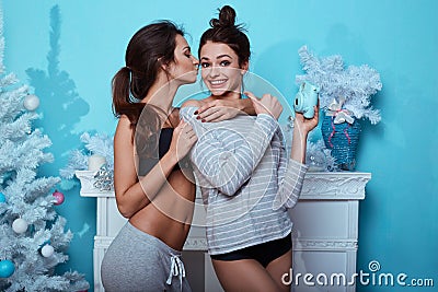 Interior lifestyle portrait of two best friends hipster crazy girls Stock Photo