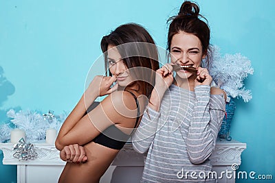 Interior lifestyle portrait of two best friends hipster crazy girls Stock Photo