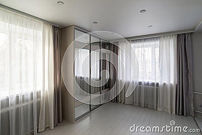 interior of living room with window and mirror wardrobe Stock Photo