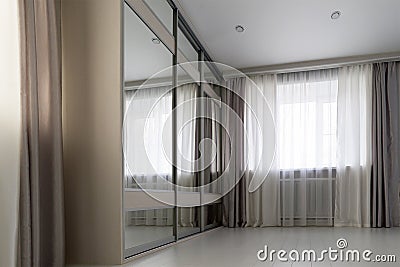 interior of living room with window and mirror wardrobe Stock Photo