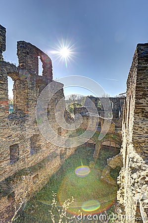 Interior of medieval castle ruins with sun glare Stock Photo