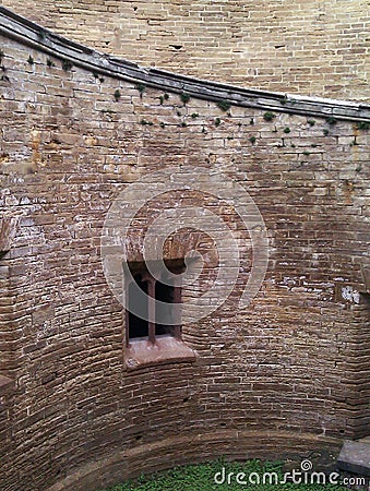 Interior of a medieval castle tower with loophole window and brick walls in England, UK Stock Photo