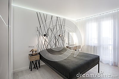 Interior of the modern bedroom in loft flat in light color style of expensive apartments Stock Photo