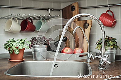 Domestic kitchen with water faucet Stock Photo