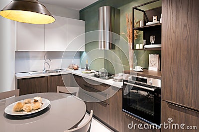 Interior of modern fitted kitchen with appliances Stock Photo