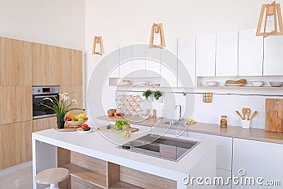 Interior of modern light kitchen with variety of appliances and Stock Photo