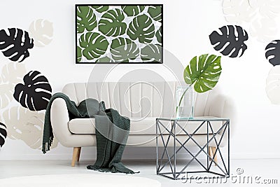 Interior with monstera leaves motif Stock Photo