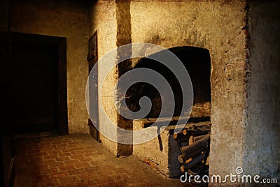 Interior of an old manor house with fireplace ready to light with logs, composition with digital texture added Stock Photo