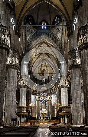 Interior of old Milan Cathedral or Duomo di Milano. It is great Catholic church, top landmark of Milan. Inside the dark Gothic Editorial Stock Photo