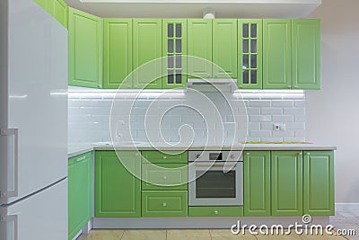 Interior photography large studio room with green modern kitchen Stock Photo