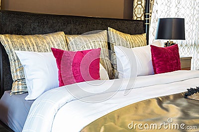 An interior picture of master bedroom with red and golden color. Stock Photo