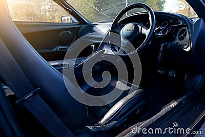 Interior of a rare Japanese sports car in the back of a gray Toyota Supra coupe with a dashboard, steering wheel, panel cockpit Editorial Stock Photo