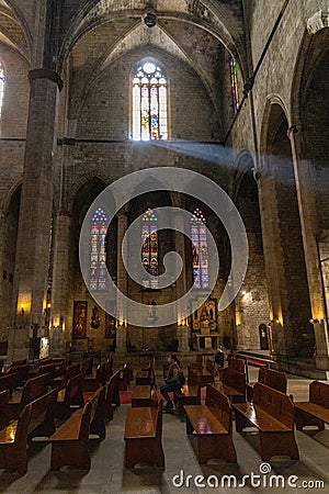 Interior of Santa Maria del Mar in Barcelona, Spain with a beam of light through the window Editorial Stock Photo