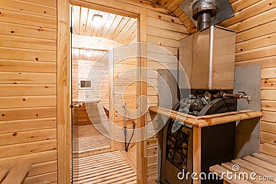 Interior of sauna. rural mobile wooden bath in the form of a barrel in a pine forest Stock Photo