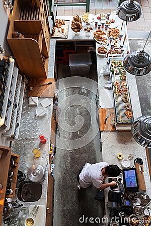 Interior of a small cafe with breakfasts in loft-style Editorial Stock Photo